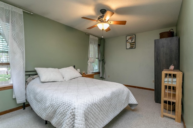 3701 Churchill Dr, Columbia, MO 65201 - carpeted bedroom with ceiling fan and baseboards