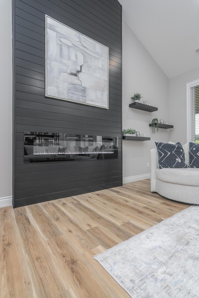 6301 Crooked Switch Ct, Columbia, MO 65201 - living room with vaulted ceiling, wood finished floors, and baseboards