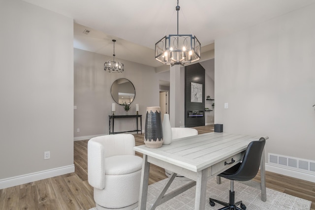 6301 Crooked Switch Ct, Columbia, MO 65201 - office featuring a chandelier, baseboards, and wood finished floors