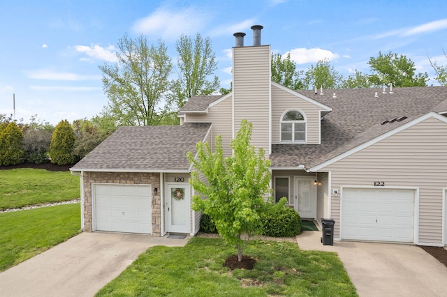 view of front of property featuring roof with shingles, an attached garage, a front lawn, a chimney, and concrete driveway