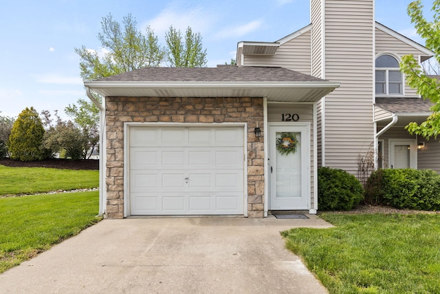 view of front of home with roof with shingles, a garage, a front lawn, concrete driveway, and stone siding