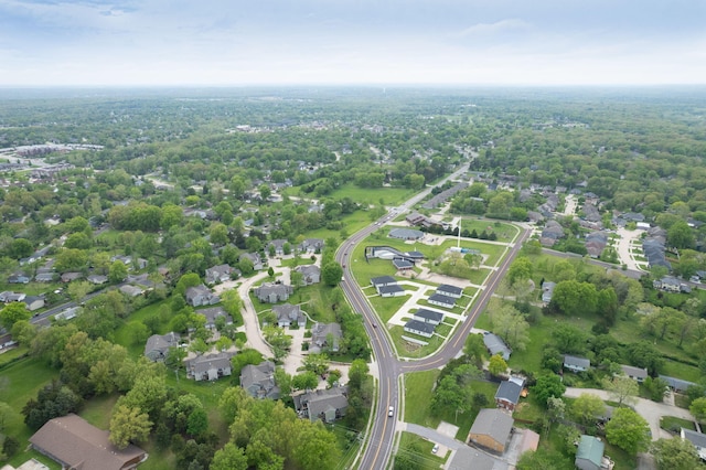 birds eye view of property with a residential view