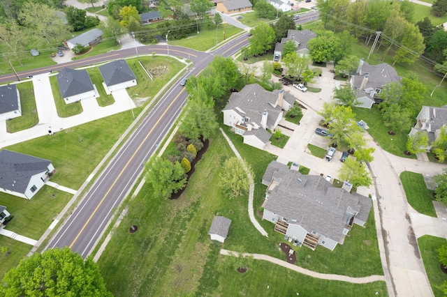 birds eye view of property with a residential view