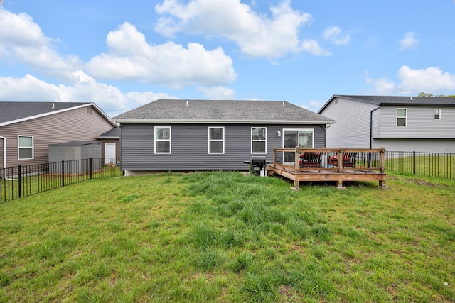 1103 Baseball Dr, Foristell, MO 63384 - back of house featuring a fenced backyard, a wooden deck, a yard, and roof with shingles