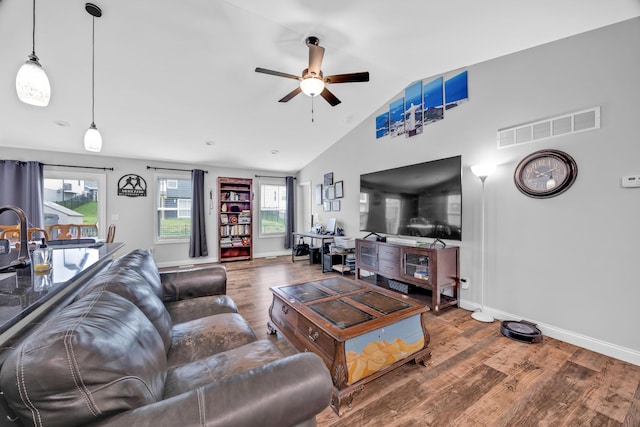 1103 Baseball Dr, Foristell, MO 63384 - living room featuring visible vents, wood finished floors, baseboards, ceiling fan, and vaulted ceiling
