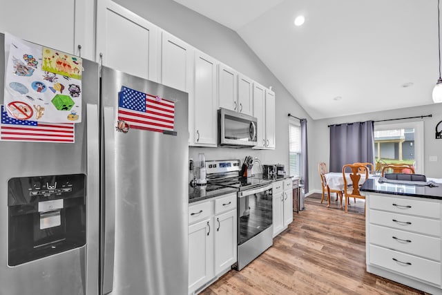1103 Baseball Dr, Foristell, MO 63384 - kitchen featuring white cabinets, appliances with stainless steel finishes, recessed lighting, light wood-type flooring, and vaulted ceiling