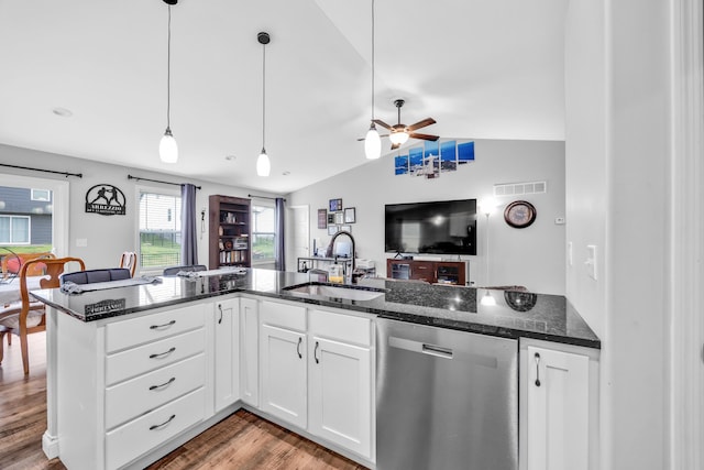 1103 Baseball Dr, Foristell, MO 63384 - kitchen featuring a sink, dark stone counters, open floor plan, stainless steel dishwasher, and vaulted ceiling
