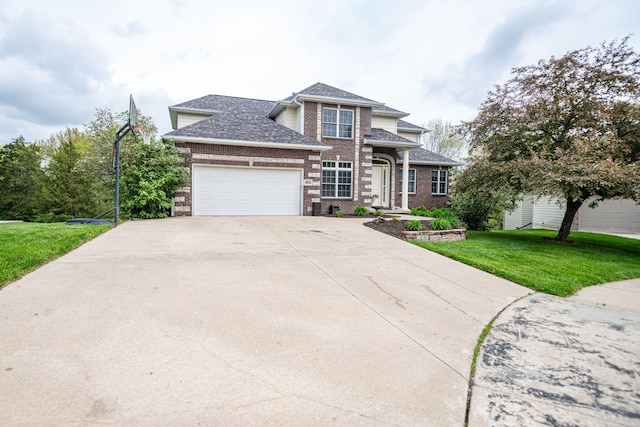view of front of home featuring a front yard, a garage, brick siding, driveway, and roof with shingles