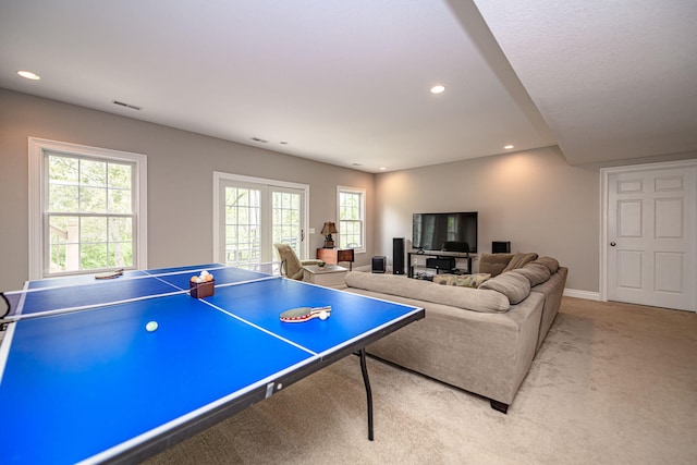 recreation room with visible vents, recessed lighting, baseboards, and light carpet