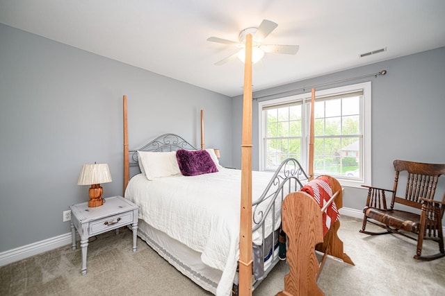 bedroom with carpet, visible vents, and baseboards