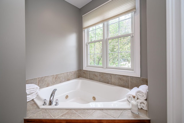 full bath with a tub with jets