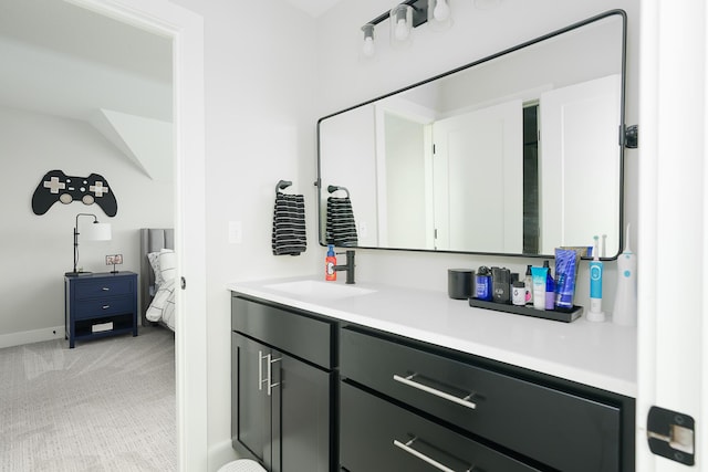 bathroom featuring baseboards and vanity