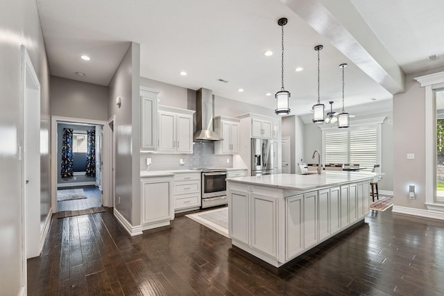 4210 Granite Springs Dr, Columbia, MO 65203 - kitchen featuring wall chimney range hood, stainless steel appliances, light countertops, dark wood-type flooring, and backsplash