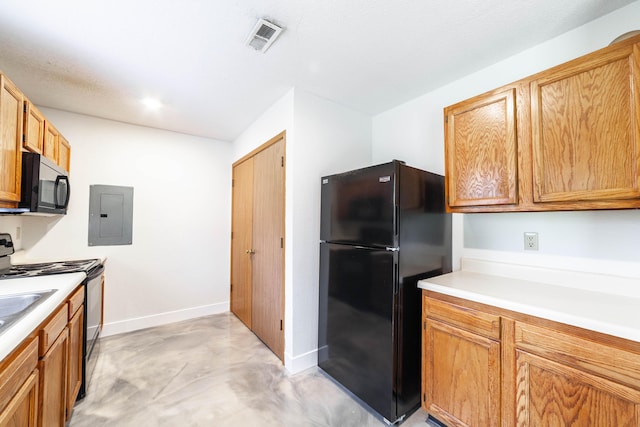 kitchen featuring black appliances, visible vents, electric panel, and light countertops