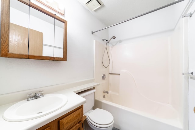 bathroom with visible vents, toilet, vanity, and bathtub / shower combination