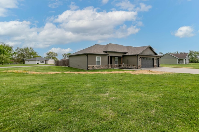 view of front of home with a front yard, a garage, driveway, stone siding, and fence