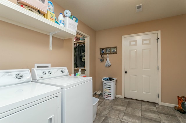 laundry area featuring baseboards, visible vents, laundry area, and independent washer and dryer