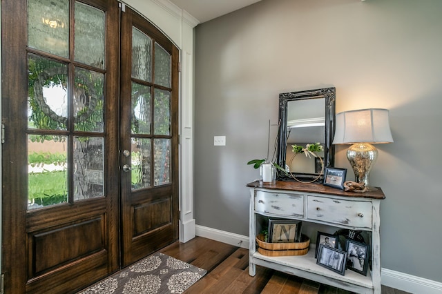 entrance foyer featuring wood finished floors and baseboards