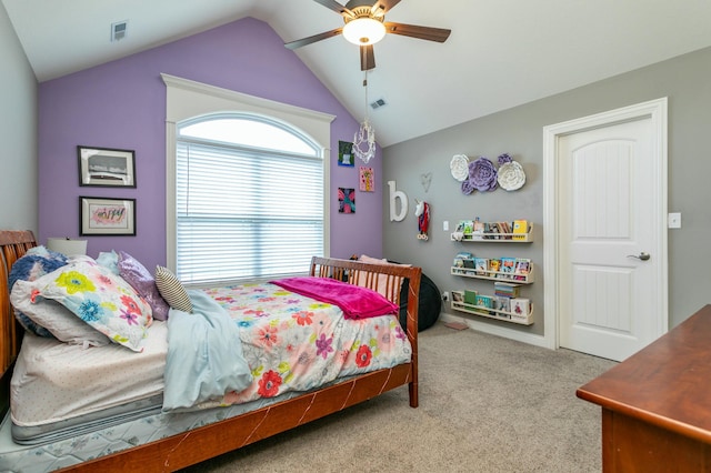 carpeted bedroom with visible vents, a ceiling fan, and lofted ceiling