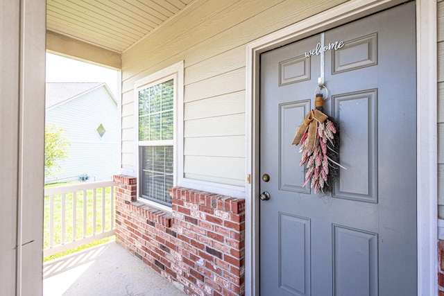 doorway to property with a porch