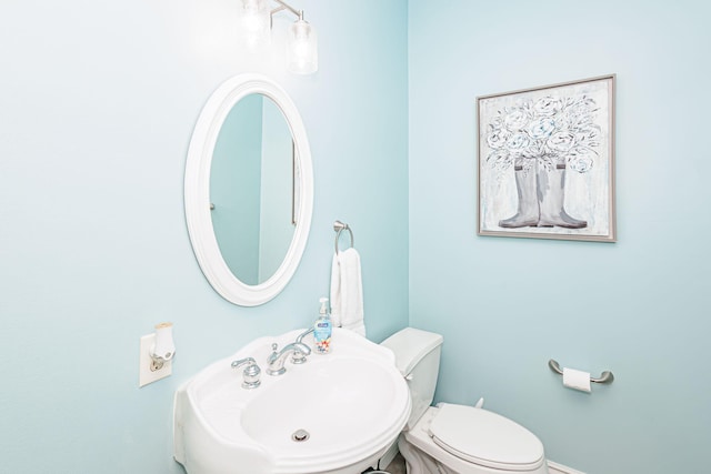 bathroom with a sink and toilet