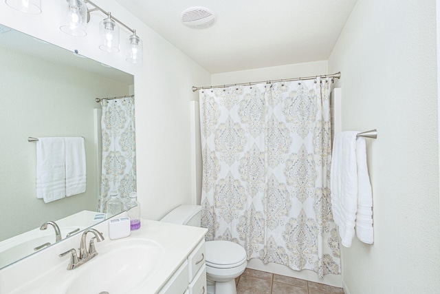 bathroom featuring vanity, toilet, tile patterned floors, curtained shower, and visible vents