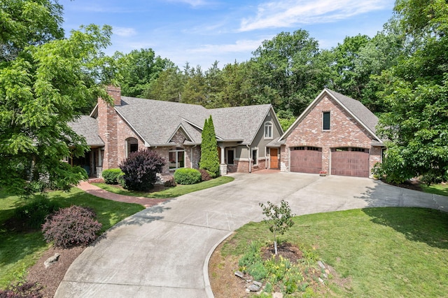 7114 W River Oaks Rd, Columbia, MO 65203 - view of front facade featuring concrete driveway, a front lawn, a shingled roof, a chimney, and brick siding