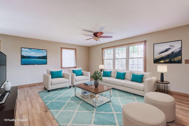 302 Park Rd, Fayette, MO 65248 - living room featuring wood finished floors, a ceiling fan, and baseboards