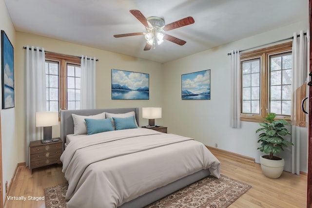 302 Park Rd, Fayette, MO 65248 - bedroom featuring baseboards, a ceiling fan, and light wood-type flooring