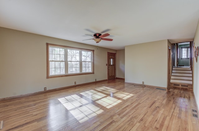 302 Park Rd, Fayette, MO 65248 - unfurnished living room featuring stairway, a ceiling fan, light wood finished floors, baseboards, and visible vents