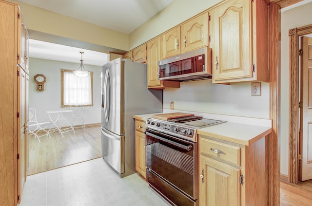 302 Park Rd, Fayette, MO 65248 - kitchen featuring light countertops, light wood-type flooring, light brown cabinetry, and stainless steel appliances