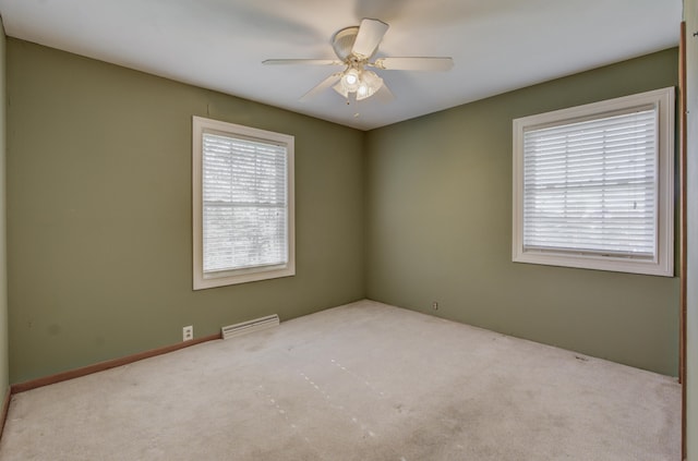 302 Park Rd, Fayette, MO 65248 - empty room featuring ceiling fan, visible vents, and carpet flooring