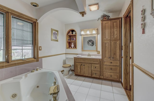 302 Park Rd, Fayette, MO 65248 - bathroom featuring toilet, vanity, tile patterned floors, and a jetted tub