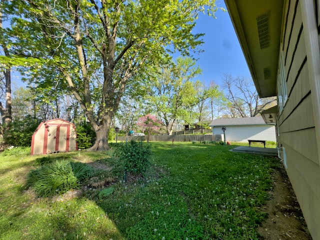 302 Park Rd, Fayette, MO 65248 - view of yard featuring a storage shed, an outbuilding, and fence