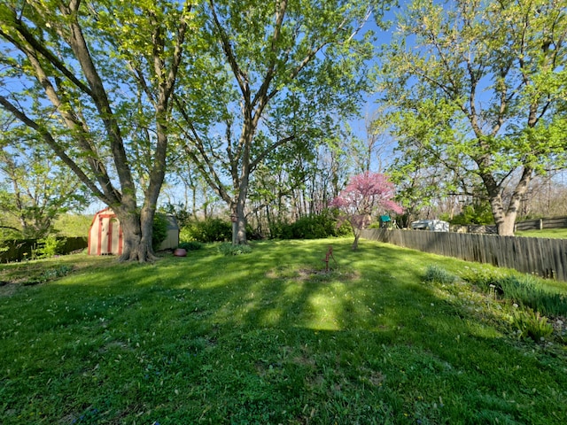302 Park Rd, Fayette, MO 65248 - view of yard featuring a storage shed, fence, and an outdoor structure