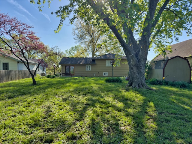 302 Park Rd, Fayette, MO 65248 - view of yard featuring a storage shed, fence, and an outdoor structure