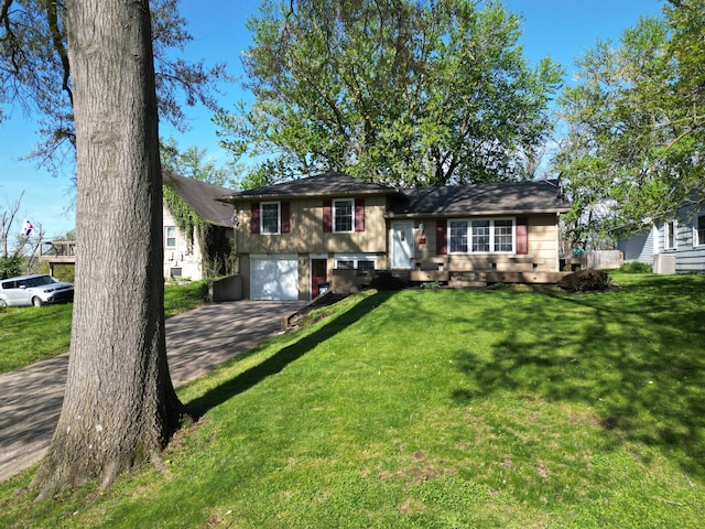 302 Park Rd, Fayette, MO 65248 - split level home featuring aphalt driveway, a front yard, and a garage