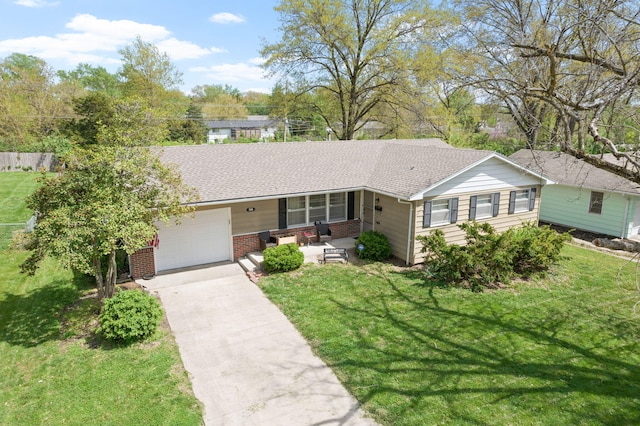 208 Bourn Ave, Columbia, MO 65203 - ranch-style house featuring a front lawn, brick siding, driveway, and a garage
