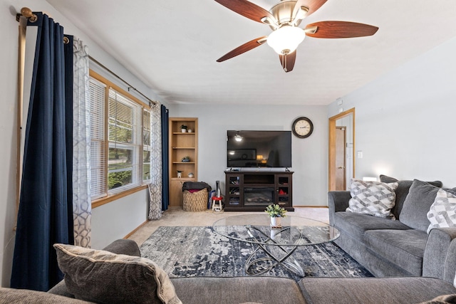208 Bourn Ave, Columbia, MO 65203 - living room featuring carpet, baseboards, and a ceiling fan