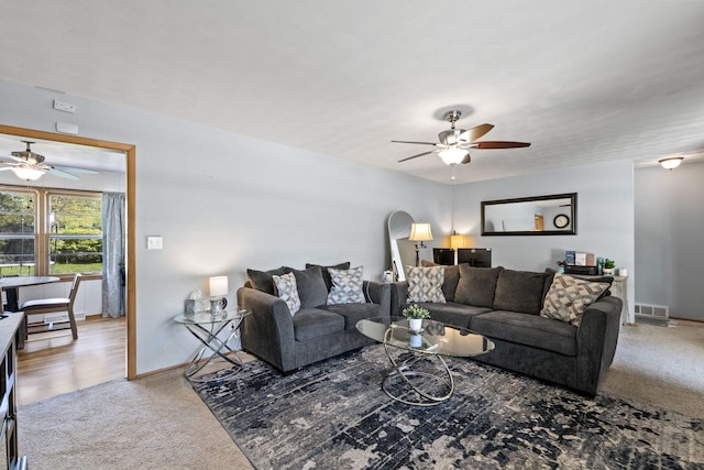 208 Bourn Ave, Columbia, MO 65203 - carpeted living area featuring a ceiling fan, baseboards, and visible vents