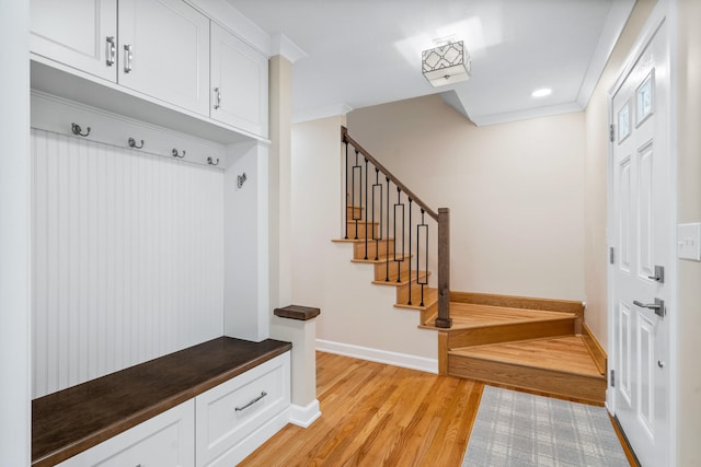 mudroom featuring ornamental molding, recessed lighting, baseboards, and light wood-style floors