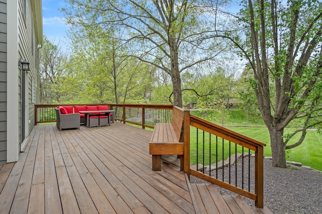 wooden deck with an outdoor hangout area and a yard