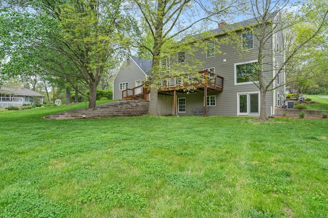 back of house with a deck, a yard, and central AC unit