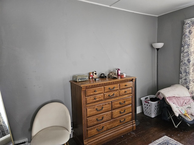bedroom featuring dark wood finished floors and ornamental molding