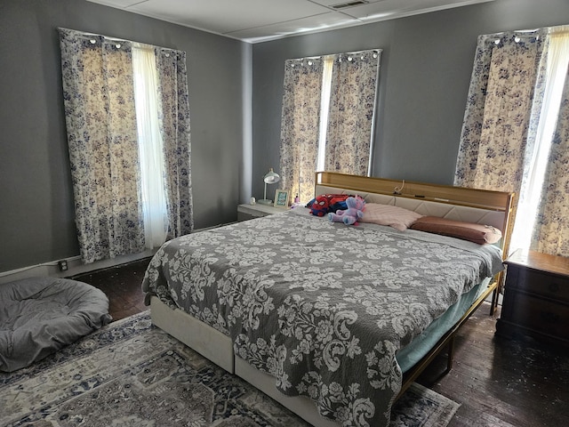 bedroom with wood-type flooring