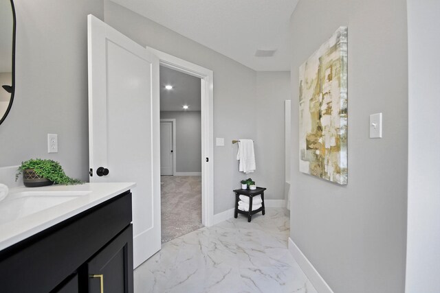 6176 Partridge Ct, Columbia, MO 65202 - bathroom with marble finish flooring, vanity, and recessed lighting