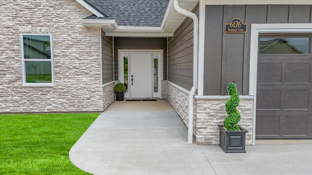 6176 Partridge Ct, Columbia, MO 65202 - property entrance featuring stone siding and roof with shingles