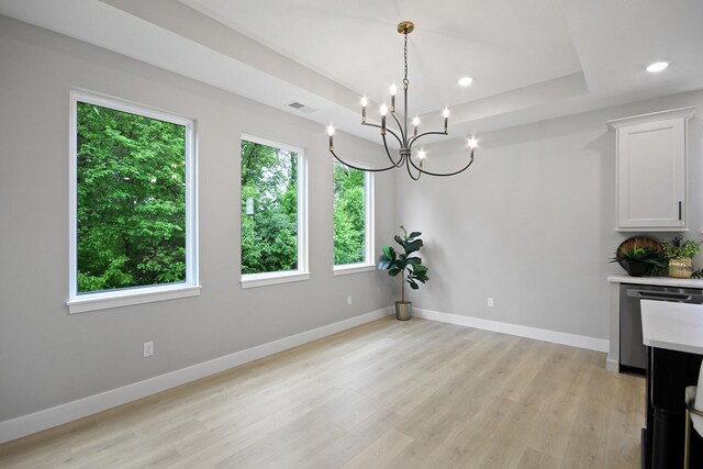 6176 Partridge Ct, Columbia, MO 65202 - unfurnished dining area with a chandelier, light wood finished floors, a raised ceiling, and recessed lighting