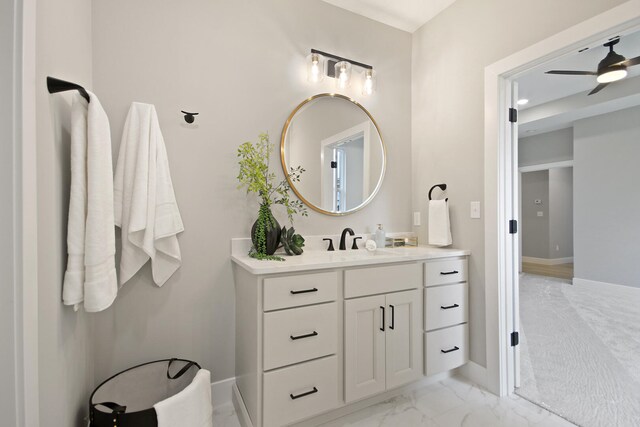 6176 Partridge Ct, Columbia, MO 65202 - bathroom with vanity, marble look tiles, and a ceiling fan