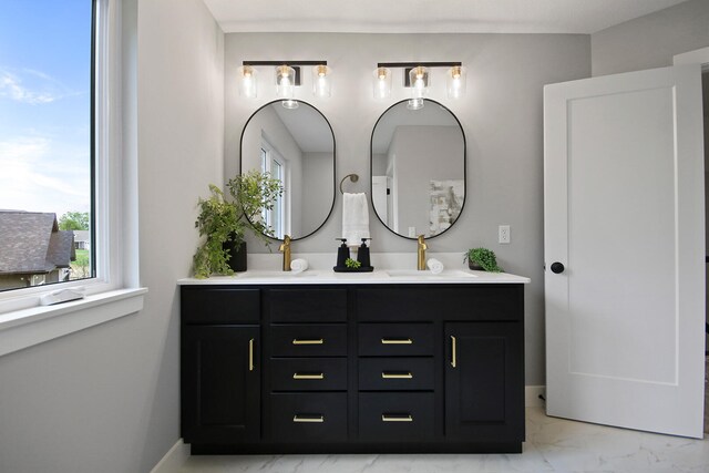 6176 Partridge Ct, Columbia, MO 65202 - full bath featuring marble look tile flooring, double vanity, and healthy amount of natural light